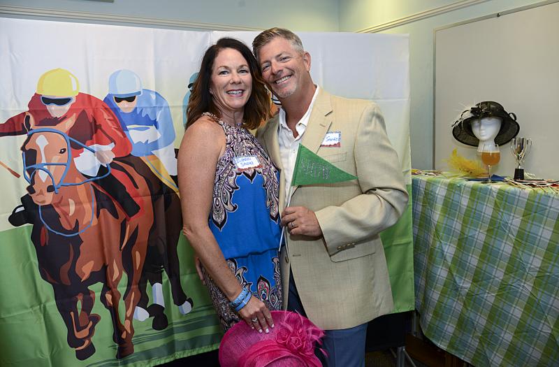Elizabeth and Mike Sanchez pose in the winner’s circle.